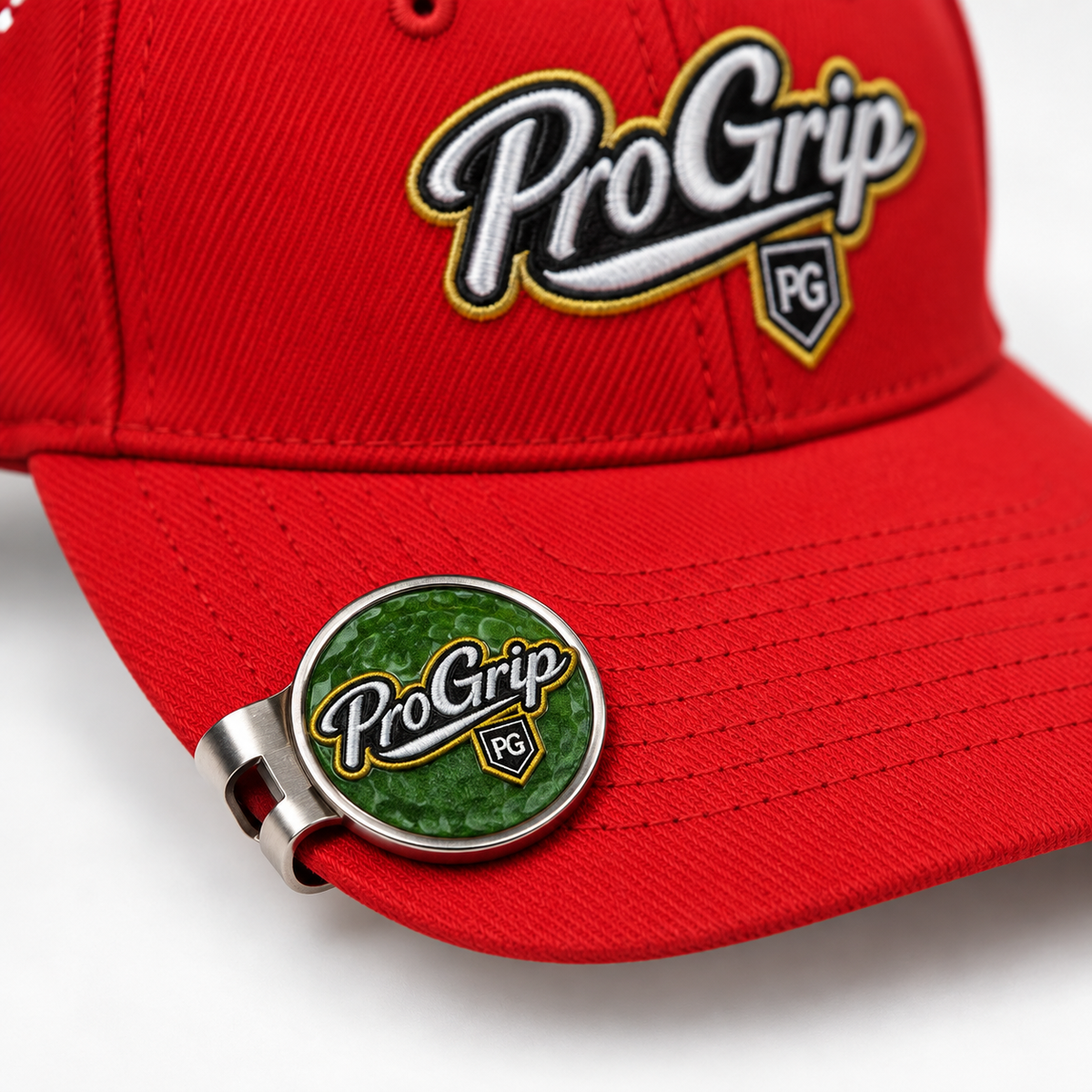 Custom magnetic golf hat clip with printed Pro Grip ball marker attached to a red golf cap
